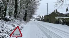 Snow and ice warnings remain after floods hit UK