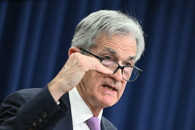 Fed cuts rates by quarter point, scales back cuts for 2025